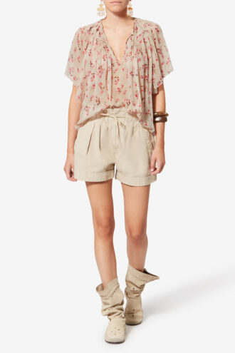 Neslya kortemouwen blouse van bedrukte mousseline